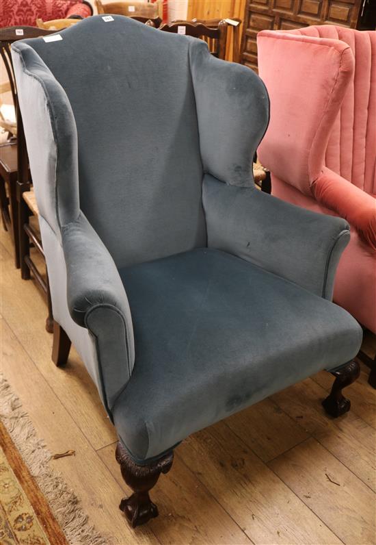 A George I style pale blue dralon upholstered wing armchair, on short cabriole legs